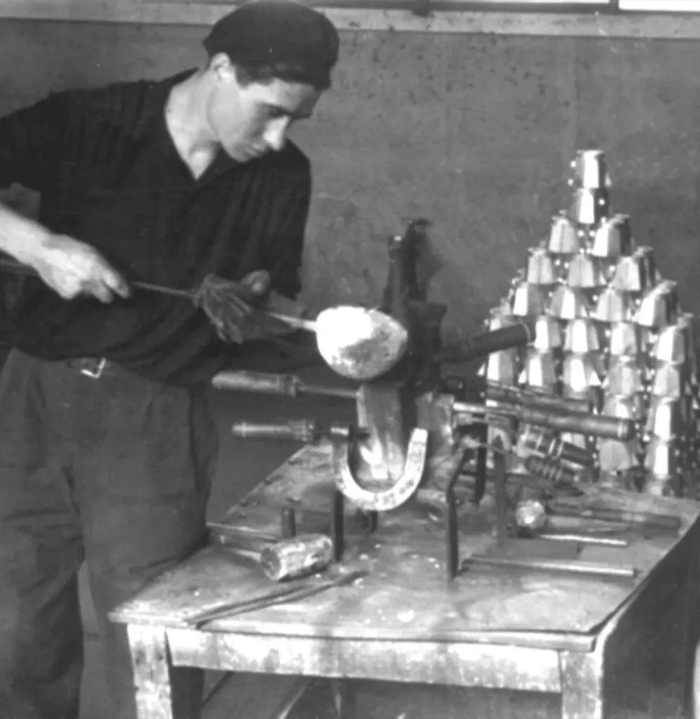 Hướng Dẫn Toàn Diện về Pha Cà Phê Bằng Moka Pot 11 Man crafting Moka Pot from aluminum in a workshop