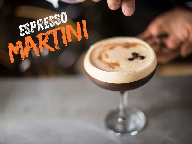 Espresso Martini cocktail in a glass with creamy foam and coffee beans garnish