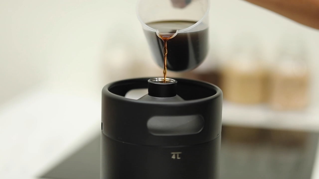 Pouring coffee into iKegger 2.0 portable coffee maker