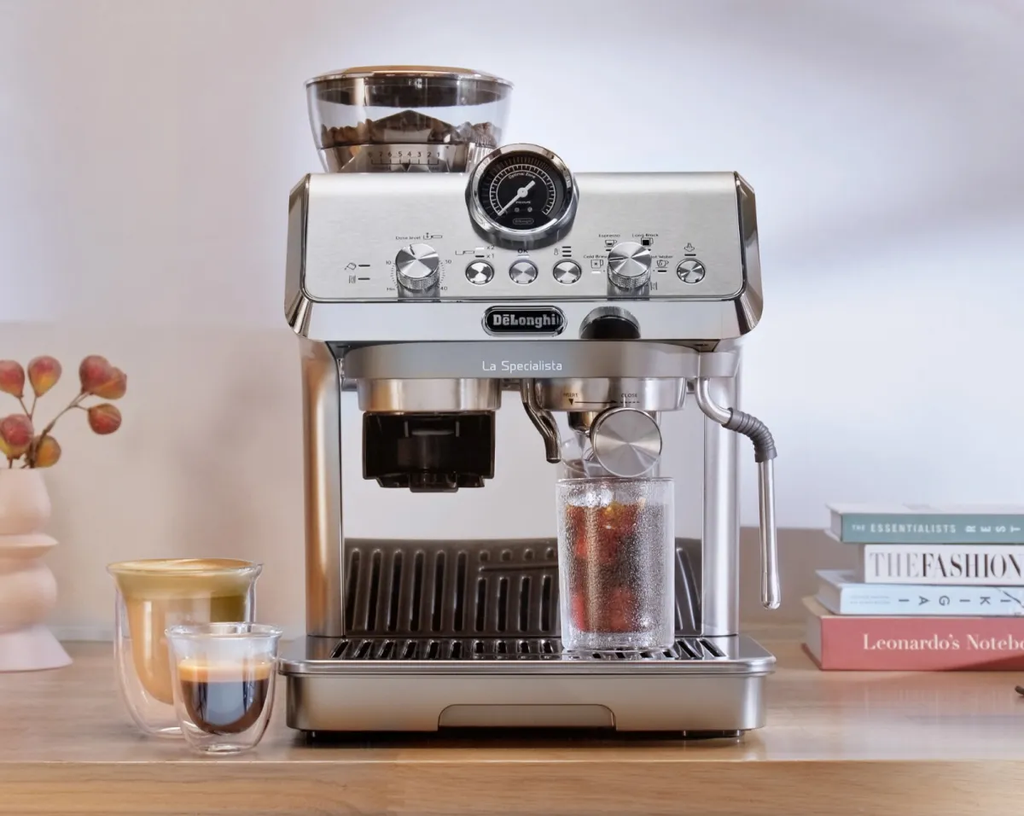 The Ultimate Coffee Maker Guide: From Basics to Pro Tips 2025 16 De'Longhi La Specialista Arte Evo EC9255M brewing espresso and iced coffee with built-in grinder and pressure gauge in modern home setting