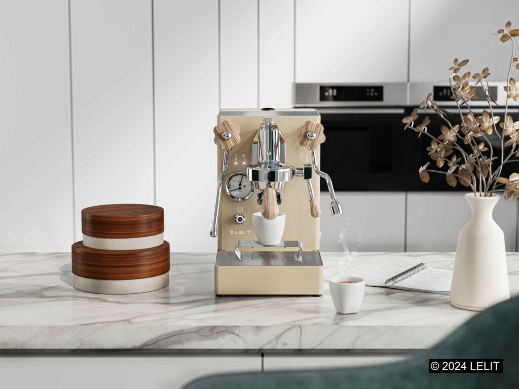 The Ultimate Coffee Maker Guide: From Basics to Pro Tips 2025 17 Lelit MaraX espresso machine in champagne finish with wooden knobs on marble countertop, styled with minimalist accessories and fresh espresso