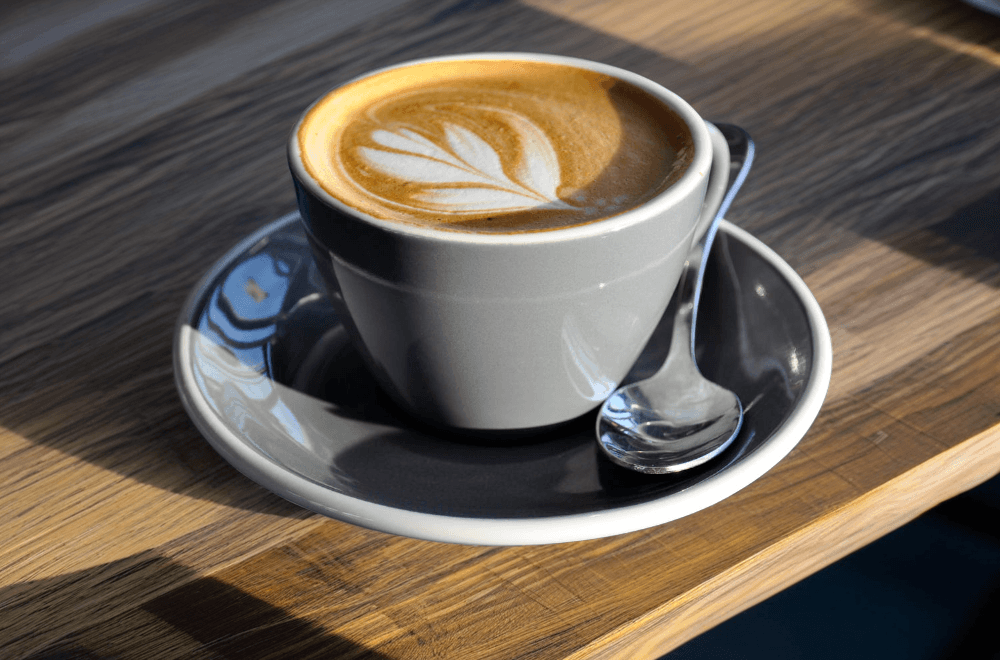 Selection of best flat white cups with perfect latte art in ceramic, glass and porcelain mugs
