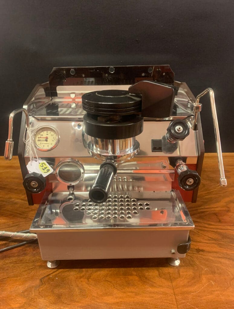 The 1970s Coffee Machine Revolution: Old Style Machines & Vintage Brewing Legacy 9 Rare transparent La Marzocco GS espresso machine from the 1970s showing internal components, pressure gauge, and chrome fixtures - a pioneering model in commercial coffee brewing