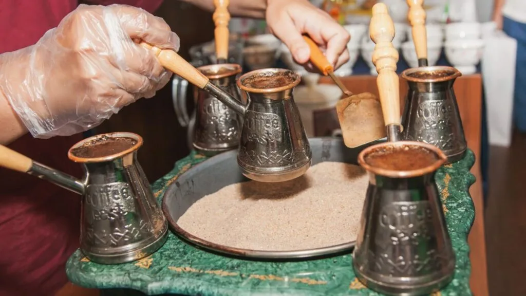 Traditional Turkish coffee brewing in a cezve: unfiltered immersion method with intense texture