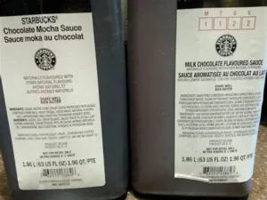 Two bottles of Starbucks Chocolate Mocha Sauce showing nutrition labels and ingredients for mocha sauce nutrition analysis