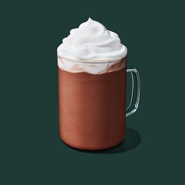 Hot Caffè Mocha at Starbucks topped with whipped cream showing rich chocolate coffee blend