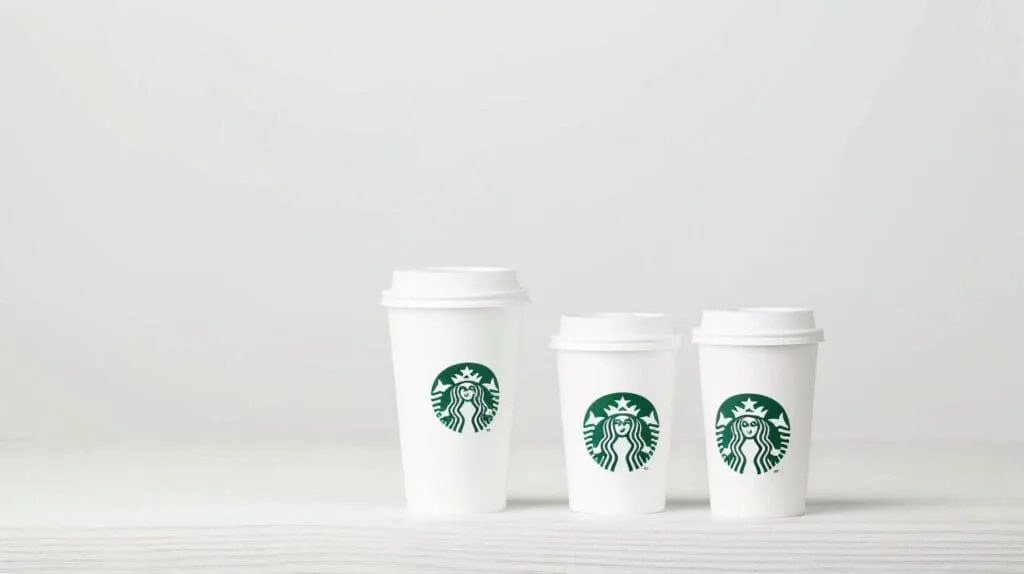 How Many Oz in a Venti? The Answer Starbucks Hopes You’ll Never Find 6 Three Starbucks hot cups visually demonstrating the size difference between the Tall, Grande, and Venti options for understanding Starbucks drink sizes.